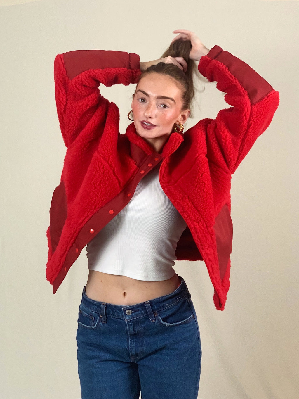 Young woman modeling premium  thick high pile red sherpa jacket.