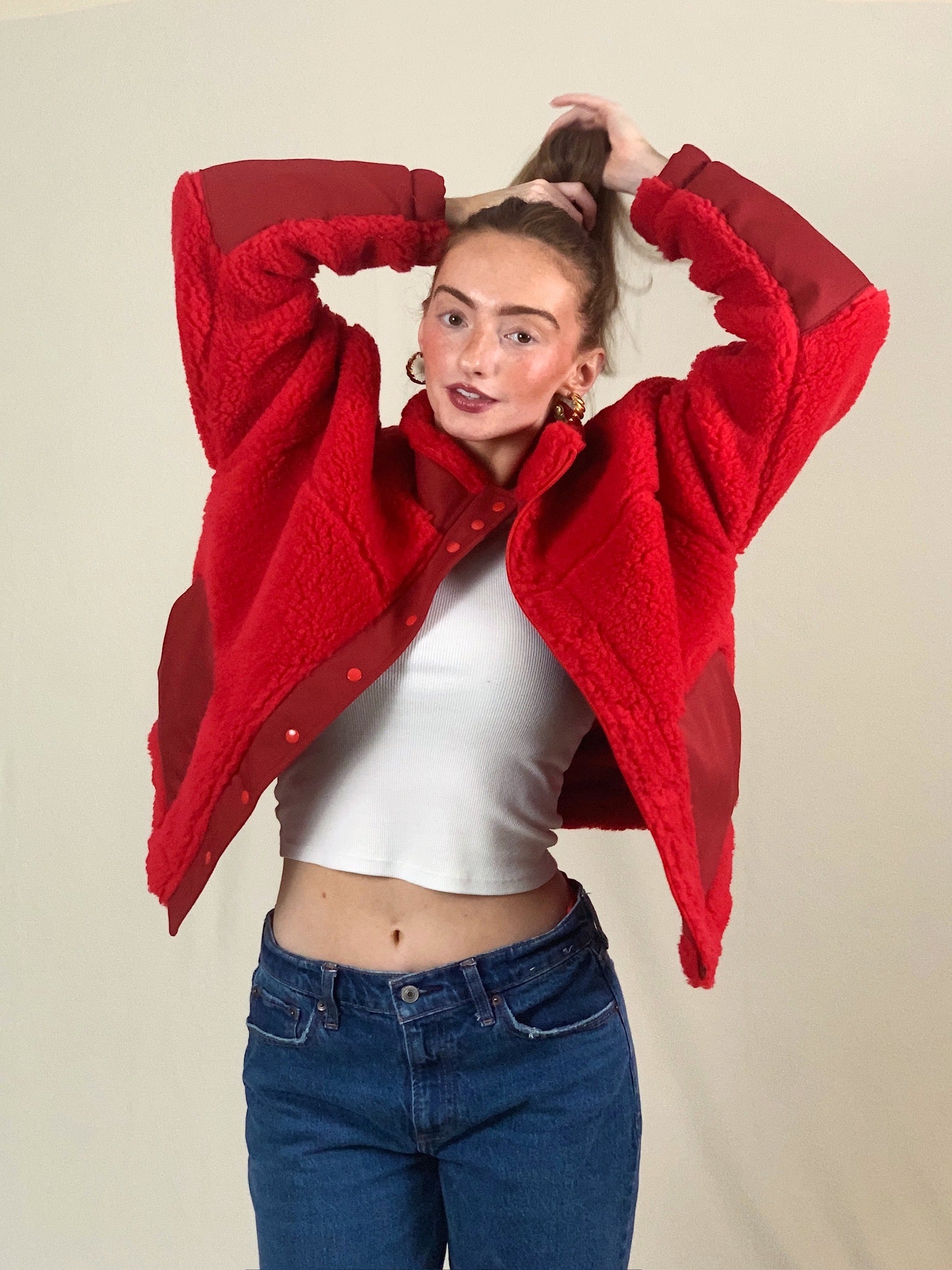 Young woman modeling premium  thick high pile red sherpa jacket.