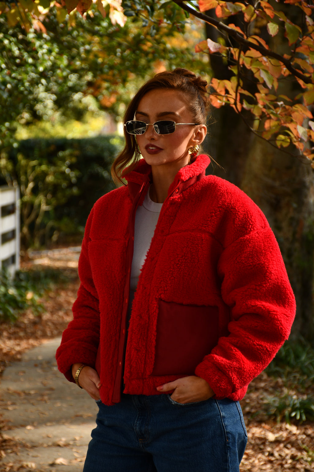 Premium sherpa jacket made in the USA on model. Red winter coat. 