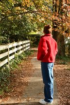 Girl in premium red sherpa jacket for winter. 