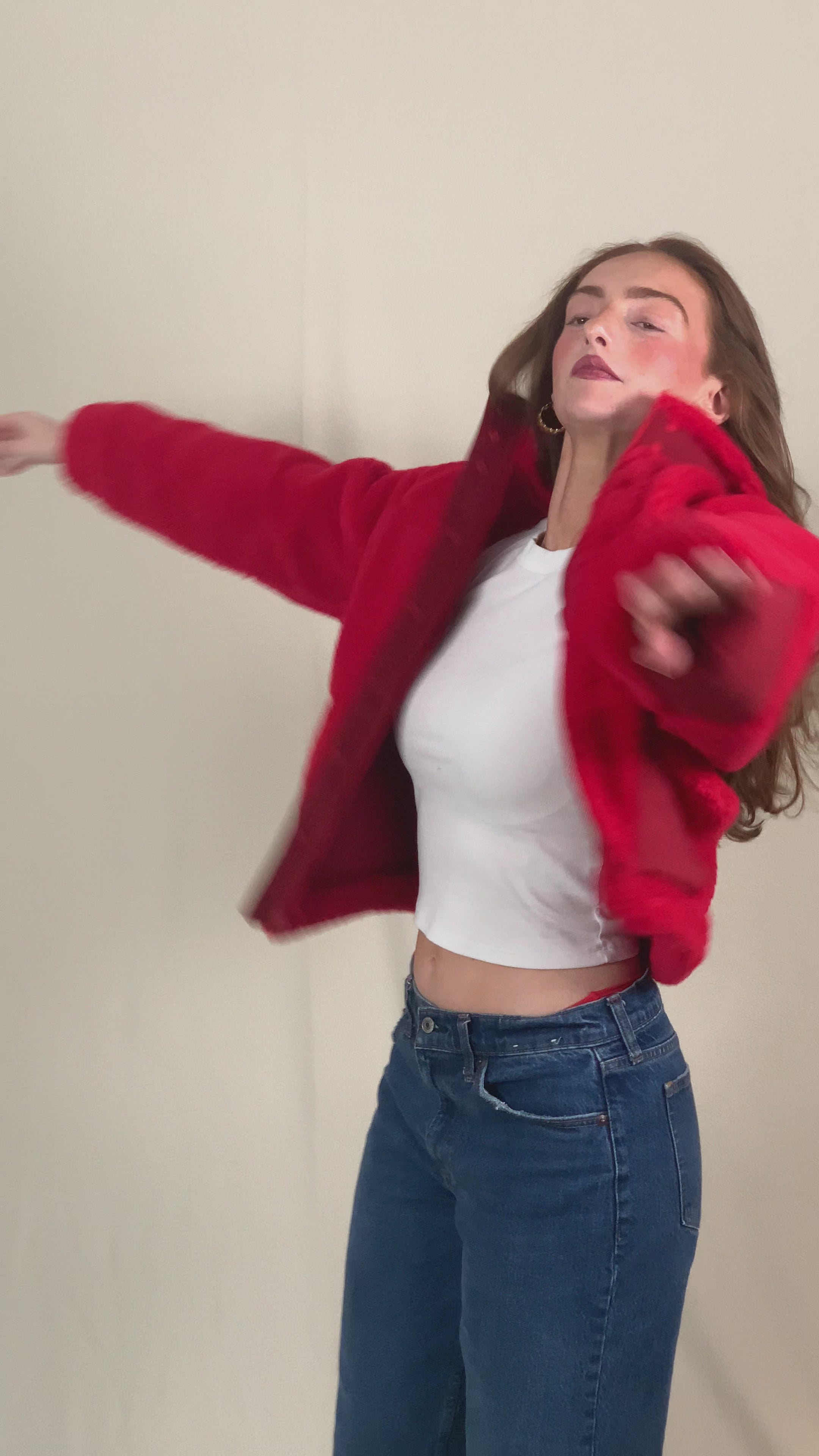 Model in premium red sherpa winter jacket. 